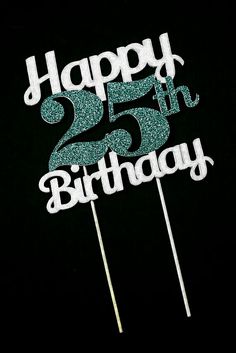 a birthday cake topper with the number twenty five on it and sparkles in the dark