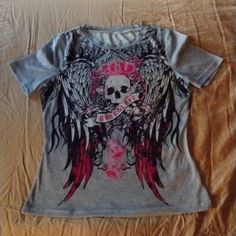 Brand New Tshirt With Gorgeous Skull And Wings In Pink Black And Grey! It's Absolutely Beautiful! Size Small!!!!! Perfect For Spring And Summer! Cute Skeleton Tshirt, Fitted Trendy T-shirt With Skull Print, Pink Cotton Emo T-shirt, Fitted Short Sleeve Emo Tops, Edgy Skull Print Crew Neck Top, Edgy Skull Print Short Sleeve Top, Edgy Pink Tops With Letter Print, Edgy Short Sleeve Top With Skull Print, Short Sleeve Grunge Top With Skull Print