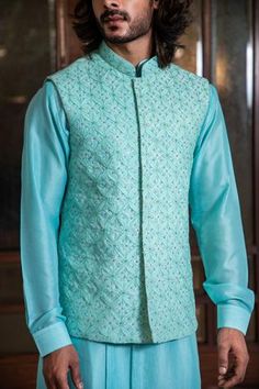 Shop for Darshika Menswear Blue Silk Blend Hand Embroidered Bundi And Kurta Set for Men Online at Aza Fashions Fitted Chikankari Embroidered Outerwear For Festivals, Fitted Chikankari Embroidery Outerwear For Festivals, Festive Fitted Outerwear With Chikankari Embroidery, Blue Bollywood Nehru Jacket With Intricate Embroidery, Fitted Blue Chanderi Sherwani, Fitted Blue Nehru Jacket With Chikankari Embroidery, Fitted Nehru Jacket With Resham Embroidery For Festivals, Fitted Blue Outerwear With Chikankari Embroidery, Blue Nehru Jacket With Chikankari Embroidery For Festive Occasions