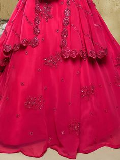 At a wedding or party, every woman wants to stand out and make a fashion statement. And with this stunning pink sequins georgette engagement wear lehenga choli, you can do just that. This beautiful set includes a pink color georgette lehenga, a matching georgette choli, and a georgette dupatta.
Made from high-quality georgette material, this semi-stitched lehenga can be adjusted to fit up to 42 inches. The 3.50mtr flair adds volume and elegance to your overall look. The intricate dori work, spar Dori Work, Georgette Material, Georgette Lehenga, Stitched Lehenga, Party Wear Lehenga Choli, Georgette Dupatta, Pink Lehenga, Party Wear Lehenga, Green Sequins