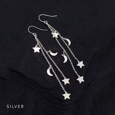 "Gold Celestial Earrings, Crescent Moon and Stars, Long Chain Earrings, Charm Earrings, Star Dangle, Festival Boho Jewelry, Silver, Rose Gold These lightweight celestial earrings feature two chain cascades with stars and crescent moons. Available in Gold, Silver, Rose Gold and Black Oxidized Silver! M A T E R I A L S ∙ A N D ∙ S I Z E * SIZE: -Length: approx. 3.25\" * METAL: - Ear Wire is 14K gold filled / sterling silver / 14k rose gold filled / black oxidized silver - Charm Chain is gold verme Celestial Silver Earrings With Dangling Charms, Silver Celestial Earrings With Dangling Charms, Star-shaped Metal Earrings With Dangling Charms, Sterling Silver Star Earrings With Dangling Charms, Moon Constellation, Star Earrings Silver, Star Earrings Dangle, Lunar Jewelry, Star And Moon Necklace