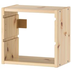 a wooden box with a door open on the inside, and a piece of wood sticking out of it's side