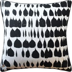 a black and white pillow with water drops on it