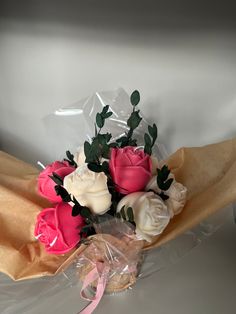 a bouquet of flowers is wrapped in plastic