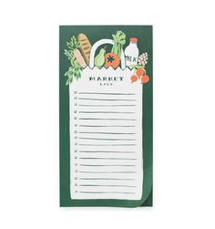 a notepad with vegetables and milk on it sitting on top of a white table