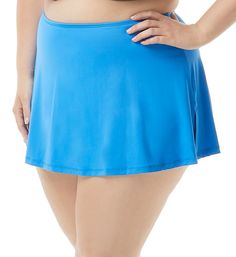 The perfect basic swim skirt with a loose feel and an attached full coverage brief underneath. Pair it with a solid black top, or any number of patterned and color options. Made of nylon and Lycra Xtra Life spandex. Waist has narrow covered elastic at the top for comfortable fit. Flared microfiber skirt has vents at sides. Hidden swim brief is same color as skirt. Swim brief has a seamless rear. Leg openings sit low at the hips and hold position with covered elastic. High rise. Full rear coverag Solid Color Swim Dress With Built-in Shorts, Swim Skirt With Built-in Shorts For Swimming, Solid Mini Skort For Poolside, Solid Color Mini Skort For Poolside, Poolside Skort With Built-in Shorts, Solid Color Tankini With Wide Waistband For Poolside, Pool Skort With Built-in Shorts, Beach Skirt With Built-in Shorts, Solid Mini Skirt Swimwear For Beachwear