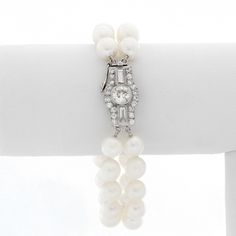 Double Strand Pearl Bracelet With Diamonds - Art deco style bracelet with 2 strands of pearls and an oversized diamond clasp. Bracelet measures approx. 6 1/2 inches with approx. 1 ct of diamonds. Pre-Owned . Luxury Double Strand Jewelry With Adjustable Chain, Luxury Double Strand Pearl Jewelry, Elegant Diamond Jewelry With Box Clasp, Classic White Gold Diamond Pearl Bracelet, Classic Diamond Pearl Bracelet For Formal Occasions, Elegant Wedding Bracelets With Clasp, Elegant Wedding Bracelet With Clasp, Elegant Pearl Bracelet With Diamond Accents, Timeless White Gold Pearl Bracelet For Anniversary