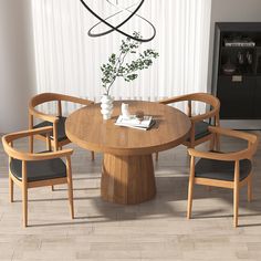 a round wooden table with four chairs around it and a vase on the table next to it