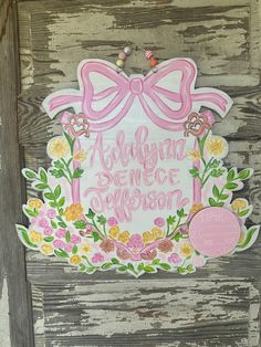 a wooden sign with pink and yellow flowers on it that says, alohana dance division