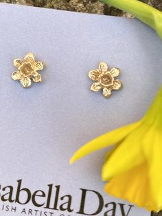 A pair of solid gold tiny daffodil earrings, beautiful little miniature studs cast from an original hand carved Victorian flower design.  The earrings are perfect for that Spring feeling after a long winter, very floral, fitting the botanical trend at the moment. Tiny floral studs are all the rage.Perfect for every day wear, the studs have lovely hand crafted solid posts and backs and every single one is handmade in my Devon studio.These little English country garden daffodils are really sweet, Yellow Gold Flower Earrings For Gift, Yellow Gold Flower Earrings As Gift, Gold Flower Earrings With 3d Flowers, Yellow Gold Birth Flower Earrings Gift, Dainty Yellow Gold Flower Earrings For Gifts, Hypoallergenic Yellow Gold Flower Earrings Gift, Yellow Gold Hallmarked Flower Earrings For Gift, Yellow Gold Birth Flower Earrings, Tiny Flower-shaped Earrings For Gift