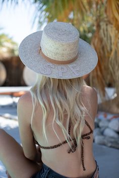 Handmade by artisans in Mexico, our new 100% baked palm leaf SPF Straw Hat is perfect for spring and summer wear. Featuring a molded crown and tightly woven pressed palm, this hat offers the most sun protection. Embellished with a faux suede band and crystal lettering. Available in the rancher or boater style straw hat. Boater - flat crown style Rancher - pointed crown style - Hat is not adjustable, has an elastic band on the inside. If you think you’ll need a tighter fit or have a smaller head, Adjustable Toquilla Straw Sun Hat With Structured Crown, Vacation Straw Hat With Structured Crown, Toquilla Straw Hat With Structured Crown For Vacation, Spring Beach Boater Hat With Structured Crown, Natural Straw Hat With Structured Crown For Vacation, Adjustable Straw Sun Hat With Structured Crown, Vacation Straw Hat With Structured Crown In Natural Color, Adjustable Structured Crown Straw Hat For Vacation, Straw Hat With Structured Crown For Beach