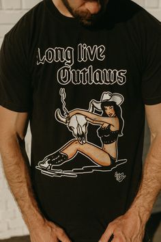 El Ray Long Live Outlaws art is licensed Comfort Colors T-shirt is true to size. Size up for more oversized fit Unisex Relaxed Fit T-shirt With Front Print For Concert, Graphic Tee Tops With Custom Artwork For Fans, Graphic Tee With Custom Artwork And Relaxed Fit, Relaxed Fit Graphic Tee With Custom Artwork, Relaxed Fit Tops With Back Print For Fans, Custom Artwork Graphic Tee With Short Sleeves, Graphic Tee With Custom Artwork And Short Sleeves, Cotton T-shirt With Custom Artwork Fan Merchandise, Cotton T-shirt With Custom Artwork For Fans