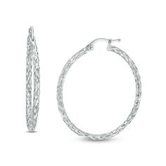 A beautiful addition to her business or casual attire, these sparkling fashion hoop earrings redefine stylish sophistication. Enchanting in cool 14K white gold, each 31.0 x 33.0mm textured hoop showcases breathtaking diamond-cut details that catch and reflect light, creating a look she won't be able to resist. Buffed to a brilliant luster, these earrings secure with latch backs. Zales Zales, Popular Jewelry, Celtic Jewelry, Casual Attire, Earring Backs, White Metal, Diamond Cut, Designer Earrings, Body Jewelry