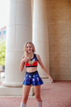 a woman in short shorts is posing for the camera