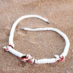 Equal parts floral & beachy, this pretty puka shell necklace oozes with island charm.  Puka shells Coral chip shells Barrel fastener Hand-made, each unique Length: ~ 16" Hawaiian Necklace, Puka Shell Necklace, Island Jewelry, Puka Shell, Shell Necklace, Hawaiian Islands, Shell Necklaces, Live Lokai Bracelet, Barrel