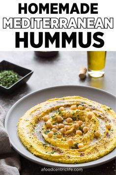 a plate with hummus on it and the words homemade mediterranean hummus above it