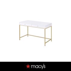 a white desk with gold legs and drawers