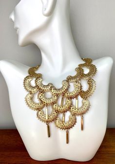 fabulous statement set signed SARAH COV. Mat gold tone texture bib necklace with matching clip on earrings perfect condition. The bib is approximately 16.5" long,5.25' wide by 4.5" with 3D rectangle dangle The clip on dangle earrings are 1 5/8" long by 1 1/8" wide, very light and comfortable to wear. All pieces are marked Sarah Coventry. I found it still in bag, I do not believe it has been wear In excellent condition, mint condition. Comes in a gift box, pack with care. ￼ Gold Bib Necklace Costume Jewelry, Gold Costume Jewelry Bib Necklace, Gold Bohemian Bib Necklace For Party, Gold Metal Bib Necklace, Gold Bib Necklace For Party Costume Jewelry, Gold Costume Jewelry Bib Necklace For Party, 3d Rectangle, Wire Crochet Jewelry, Nugget Bracelet