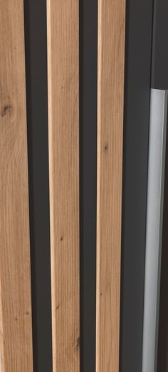 a close up view of the wooden slats on a door with metal bars in it