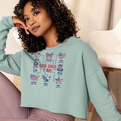 Celebrate your faith and patriotism with our "God Says I Am" Crop Sweatshirt. Perfect for the 4th of July, this inspirational Christian tee showcases USA pride. It's an ideal faith-based gift for her, combining style and comfort in a meaningful way. Did you know that fashion and comfort can be combined? This fleece crop sweatshirt is here to prove the point. The soft fabric feels extra soft to the touch, and the trendy cut with a ribbed neckline and raw hem comes right out of fashion magazines while still keeping it casual. * 52% airlume combed and ring-spun cotton, 48% poly fleece * Fabric weight: 6.5 oz/yd² (220.39 g/m²) * Ribbed crew neckline and cuffs * Dropped shoulder cut * Cropped body with a raw hem * Side-seamed * Blank product sourced from Nicaragua This product is made especiall Long Sleeve Cotton Tops For 4th Of July, Cotton Long Sleeve Top For 4th Of July, Patriotic Long Sleeve American Flag Top, Patriotic Long Sleeve Top With American Flag Print, Casual Letter Print Tops For Veterans Day, Independence Day Cotton Letter Print Sweatshirt, Independence Day Cotton Sweatshirt With Letter Print, Patriotic Independence Day Tops With Relaxed Fit, Patriotic Tops For Independence Day With Relaxed Fit