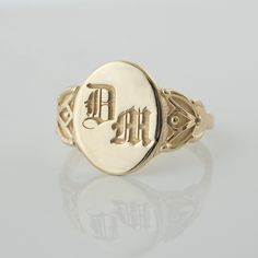 This vintage-style signet ring is inspired by our classic botanical style, and features leaf-like flourishes on each size, framing a simple center that displays your personal monogram or initials. CUSTOMIZATION AND FONTS * Usually Gothic letters are preferred for this ring, but I can place any type of design or font. * This ring can be customized with any letter or word (provided it fits) and is made in solid gold. This ring can be made for men or women and in your preferred size or color of gol Heirloom Classic Signet Ring, Vintage Oval Engraved Ring With Initials, Vintage Initials Signet Ring, Vintage Signet Ring With Initials, Antique Signet Ring With Initials For Anniversary, Classic Yellow Gold Signet Ring With Initials, Vintage Formal Signet Ring With Initials, Classic Oval Engraved Ring, Classic Signet Ring With Initials