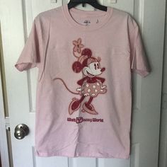 Purchased At Disney. Never Worn. Disney Minnie Mouse Pink T-shirt, Minnie Mouse Short Sleeve T-shirt For Disney Trips, Cute Pink Minnie Mouse T-shirt, Disney Pink Minnie Mouse T-shirt, Minnie Mouse Crew Neck Top For Disney Events, Pink Minnie Mouse T-shirt For Disney Fan Events, Disney Character Print Cotton T-shirt, Pink Fun T-shirt For Disney Fan Events, Pink Cotton Mickey Mouse T-shirt