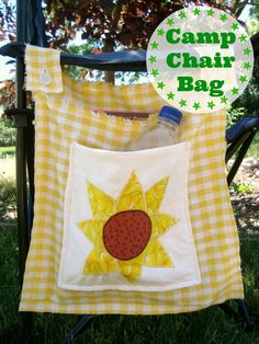 a yellow and white checkered shirt with a sunflower on it, sitting in the grass