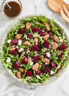 This beet salad is beautiful and bold with fresh arugula, crunchy candied pecans then tossed in a zesty balsamic dressing. It's stunning on any holiday table! Cranberry Spinach Salad, Salad With Balsamic Dressing, Winter Salad Recipes, Beet Salad Recipes, Roasted Beet Salad, Roasted Root Vegetables, Salad Wraps