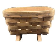 a wooden basket sitting on top of a table