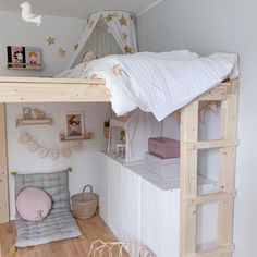 a loft bed is in the middle of a room