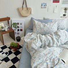 a bed sitting in a bedroom next to a checkered floor