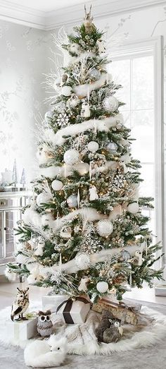 a white christmas tree in a living room