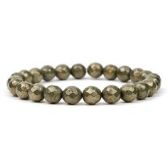 Natural Pyrite 8mm faceted beads Approx. 7.5" Strung on high quality rubber elastic Handcrafted at Beads Of Paradise NYC Pyrite is a metallic mineral that derives from iron. Because of its color, it has also been given the nickname, “fool’s gold.” Most Pyrite comes from the United States, although it is also found across Europe. Pyrite is usually found associated with other sulfides and oxides and is found in quartz veins, coal beds and even sometimes in fossils. Despite being nicknamed fool's g Spiritual Stretch Bracelet With Faceted Round Beads, Spiritual Faceted Round Beads Stretch Bracelet, Pyrite Meaning, Pyrite Crystal Affirmation, Fool’s Gold, Pyrite Bracelet, Pyrite Pendant, Pyrite Crystal, Faceted Bead