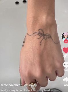 a person's hand with a tattoo on it and the caption says, i love you