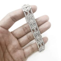 A beautiful Art Deco and retro vintage inspired diamond platinum bracelet. Covered in stunning round cut white natural diamonds 11.29 ct in total. Diamonds get that extra sparkle against the silver brilliance of the platinum 950 metal. Diamonds are all natural in G-H Color Clarity VS. Length: 17.3 cm Width. 1.5 cm Weight: 48.5 g [shortcode] [video] [/video] [/shortcode]