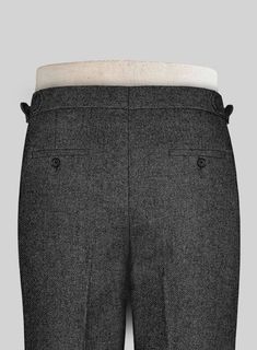 Smart gray pants are a foundational building block for your suiting wardrobe. Crafted from pure wool, the Vintage Dark Gray Weave Tweed pants are elegant and up to date choice for those in the sartorial know. 
 
 Look Includes  Vintage Dark Gray Weave Tweed Fabric  Cross Pocket  Forward 2 Pleats  Side Tabs (No Loops)- Arrow Shape  Bottom Cuff (1.5")  Two Welted Back Pockets on Trousers   
 You can change the look during customization if required. 
 
 Lining: Viscose, Dry Clean.