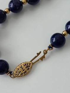 "Cheer up with this genuine blue lapis with gold tone spacer beads. Lapis stones have gold lines and are approx. 8mm. round Clasp: filigree fishhook Length approx. 25\" Condition: Good vintage" Sapphire Colored Lapis Lazuli Round Bead Jewelry, Sapphire-colored Lapis Lazuli Round Beaded Jewelry, Traditional Jewelry With Round Lapis Lazuli Beads, Sapphire Single Strand Lapis Lazuli Jewelry, Sapphire Color Single Strand Lapis Lazuli Jewelry, Sapphire Jewelry With 8mm Beads, Single Strand Lapis Lazuli Round Bead Jewelry, Handmade Royal Blue Round Beads Jewelry, Elegant Beaded Necklaces With Round Lapis Lazuli Beads