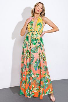 Indulge in the timeless elegance of our woven maxi dress, printed with a charming halter neckline and a full, flowing skirt. The plunging back and delicate neck tie add a touch of sophistication to this exquisite piece. Details:Self : 100% PolyesterLining : 100% PolyesterSize & Fit- Model is 5`8" And Wearing Size Small- Measurements Taken From Size Small- Approx. Length: 60" Green Backless Maxi Dress For Garden Party, Printed Backless Maxi Dress For Vacation, Backless Printed Maxi Dress For Beach, Flowy Floor-length Halter Dress For Beach, Floor-length Halter Dress For Spring Vacation, Floor-length Tie Back Halter Dress For The Beach, Floor-length Flowy Halter Dress For The Beach, Multicolor Tie Back Maxi Dress For Garden Party, Multicolor Maxi Dress With Tie Back For Garden Party