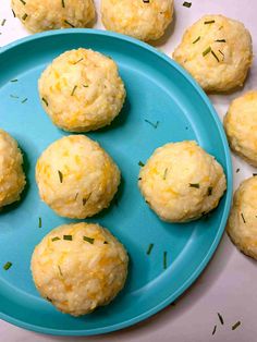 several biscuits on a blue plate with sprinkles