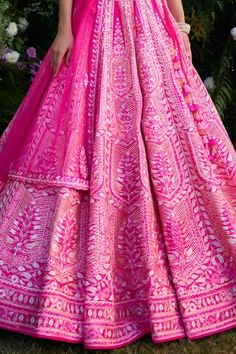 Fuchsia pink raw silk lehenga with an attached cancan and gota and thread embroidery. Comes with a padded blouse, a dupatta and a belt. - Aza Fashions Pink Sets With Motifs For Reception, Pink Saree Dress With Motifs, Pink Anarkali Set With Motifs For Wedding, Pink Saree With Motifs, Fitted Pink Anarkali Set With Motifs, Pink Motif Anarkali Set For Wedding, Pink Motif Sharara For Reception, Pink Wedding Anarkali Set With Motifs, Wedding Sets With Pink Motifs