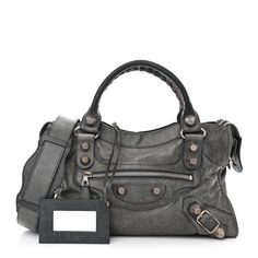 This is an authentic BALENCIAGA Agneau Giant 21 Silver Hardware City in Anthracite. This is a chic large tote that is finely crafted of lambskin leather in dark grey. The bag features rolled leather top handles with hand-stitched detail, a front zipper pocket for the hanging mirror, leather belts and patches, and silver hardware including buckles and giant studs. The top zipper opens to a black fabric interior with a zipper pocket. Balenciaga Coat, Backpack With Wheels, Matte Black Hardware, Hanging Mirror, Mini Purse, Black Hardware