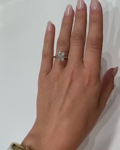 a woman's hand with a ring on it