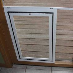 an open sliding glass door with blinds on it