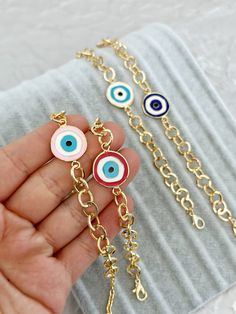 G O L D ∙ L I N K ∙ C H A I N ∙ E V I L  E Y E ∙ B R A C E L E T Evil Eye Bracelet, Enamel Evil Eye Beads, Birthday Gift for Her, Gold Link Chain Bracelet, Greek Evil Eye Jewelry, Red Pink Evil Eye ♥ It is a gold cuban chain bracelets which are the most unique jewelry you can find with charm. ♥ These Evil Eye Bracelets are perfect gift for you and your loved ones.  ♥  Please choose evil eye colors during checkout  ♥ Material: High quality stainless steel with plated  ♥ All our evil eye jewelries Round Charms Bracelets For Birthday Gift, Pink Chain Bracelet With Adjustable Chain As A Gift, Charms Bracelets For Birthday Gift, Red Charms Jewelry For Birthday, Nickel-free Red Beaded Bracelet As Gift, Birthday Gift Bracelets With Charms, Gold Evil Eye Bracelet With Charms As Gift, Gold Evil Eye Bracelet With Charms For Gift, Gold Evil Eye Bracelet For Friendship