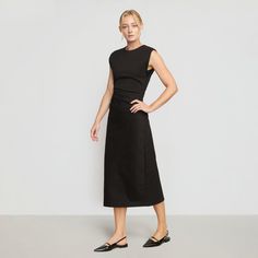 An architectural silhouette in luxe cotton twill, Iman is a classic in the making. With an elegant neckline, chic ruching, and a split-hem for ease, this dress is an easy choice for any upcoming occasions. See below for our general Size Guide and available measurements Self made of 97% cotton and 3% spandex, lining made of 100% cotton Machine wash cold and lay flat to dry Chic Ruched Midi Dress For Work, Chic Ruched Dress For Work, Classic Ruched Midi Dress, Workwear Dresses With Side Slits, Workwear Midi Dress With Ruched Fitted Bodice, Workwear Midi Dress With Fitted Bodice And Ruched Detail, Chic Office Dresses With Ruched Detail, Classic Ruched Midi Dress For Work, Ruched Midi Length Sleeveless Dress For Work