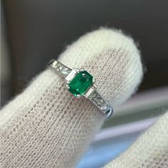 The Center Stone In This Ring Is Approximately Half A Carat. It Is A Natural Emerald Cut Zambian Emerald That Is So Clean And Contains Very Minimal Inclusions. The Center Stone Has So Much Vivid Green Color And Life Too It. The Diamonds On The Side Are High Quality As Well And They Shine Very Sparkly And White In The Showcase Lighting. These Stones Are All Set In A 18kt Gold Mounting. Retails 5000$ My Price Is Negotiable. Emerald And Diamond Ring, Zambian Emerald, Natural Emerald, Womens Jewelry Rings, Emerald Cut, Green Color, Green Colors, Diamond Ring, Emerald