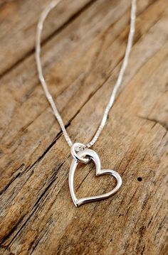 A beautiful heart charm necklace carefully placed on a sterling silver box chain. This is placed on your choice of 16, 18, or 20 inch sterling silver .89mm box chain. Delicate Silver Heart Jewelry, Delicate Heart Shaped Silver Jewelry, Delicate Double Heart Jewelry As Gift, Delicate Double Heart Sterling Silver Jewelry, Delicate Silver Open Heart Jewelry, Delicate Open Heart Silver Jewelry, Delicate Silver Necklace For Anniversary Gift, Elegant Nickel-free Heart Necklace, Mother's Day Heart Pendant Jewelry