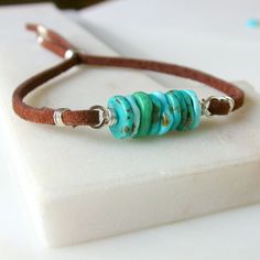 Perfect in its simplicity. A stack of genuine turquoise with soft, genuine suede leather. Sliding coiled bead for closure. Available in sterling silver, 14k gold fill and rose gold fill. Two sizes. 5" too 8" and 7" to 10". I use only the finest quality materials to make my pieces. Each stone is carefully selected and I never use plated materials. All chains, wires and findings are sterling silver or 14k gold fill. I guarantee all of my work, including materials as well as the craftsmanship. I wi Turquoise Boho, Genuine Turquoise, Suede Leather, Brown Leather, Or Rose, Cuff Bracelets, Leather Bracelet, Jewelry Bracelets, Bracelet