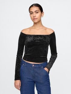 Soft, stretch velour cropped top.  Off-the-shoulder neckline.  Long sleeves.  Fit: Close to the body.  Cropped, hits at the waist.  Models wearing Gap Fitted Cropped Top By Gap, Fitted Gap Crop Top For Spring, Cropped Tops For Evening Wear In Fall, Black Fitted Cropped Off-shoulder Top, Evening Cropped Stretch Top, Gap Fitted Tops For Fall, Fitted Off-shoulder Crop Top For Party, Fitted Off-shoulder Crop Top For Night Out, Fitted Gap Tops