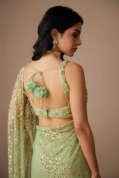 Mint green saree with sequin embroidered motifs. Paired with embroidered, padded blouse and petticoat.
Components: 3
Pattern: Embroidered
Type Of Work: Nakshi, Cutdana, Sitara
Neckline: Scoop
Sleeve Type: Sleeveless
Fabric: Net, Crepe
Color: Green
Other Details: 
Floral pattern
Back tassel tie-up
Occasion: Bride,Wedding - Aza Fashions Embellished Pista Green Pre-draped Georgette Saree, Green Pre-draped Saree With Mirror Work For Reception, Green Georgette Blouse With Mirror Work, Green Zari Work Party Wear Blouse, Green Zari Work Blouse For Party Wear, Embellished Green Georgette Saree, Pista Green Saree With Unstitched Blouse For Party, Green Embellished Semi-stitched Pre-draped Saree, Green Pre-draped Party Saree With Pallu